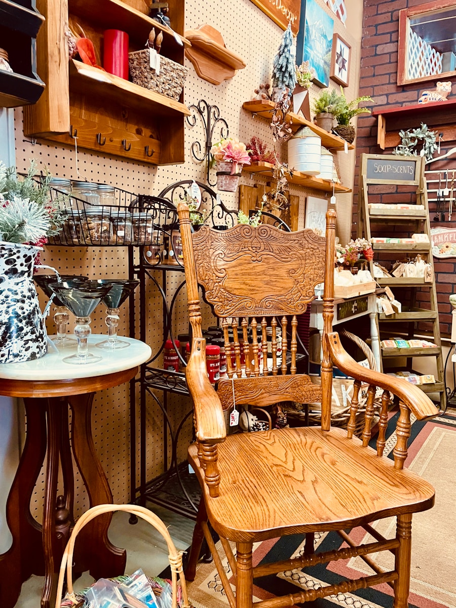 A wooden rocking chair sitting next to a table